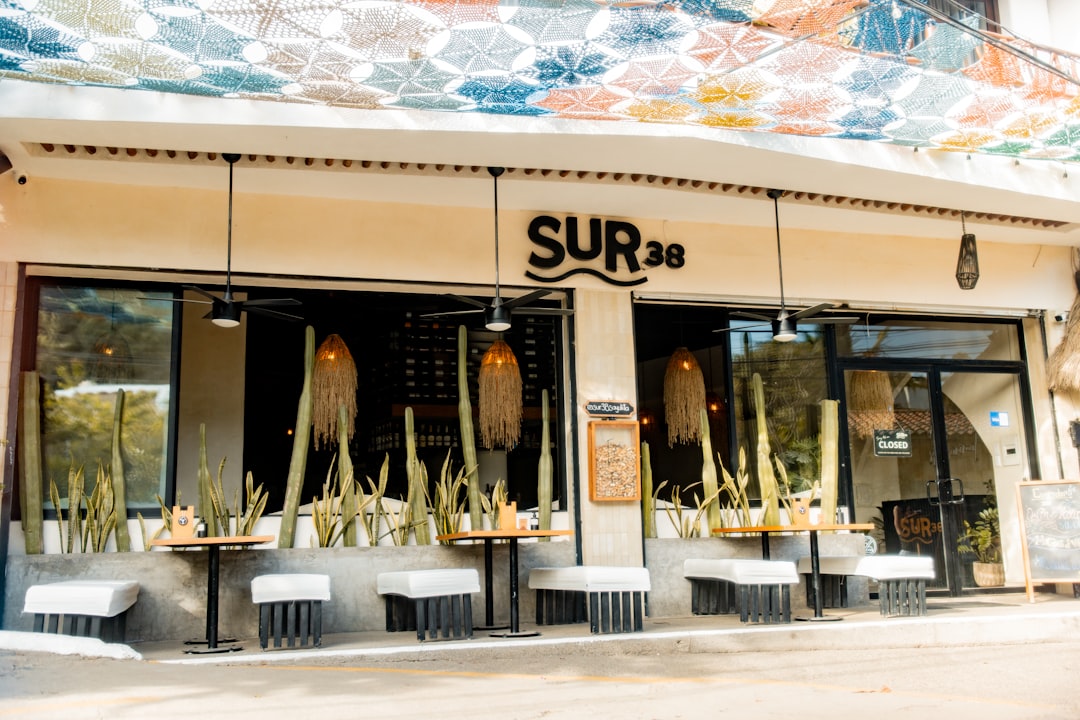 A restaurant with a mural on the side of the building